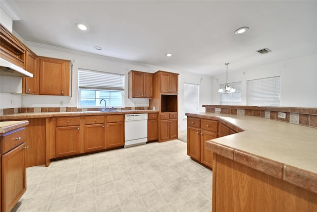 11307 Normeadow Ln, Houston, TX 77076 - kitchen featuring white dishwasher, brown cabinetry, a chandelier, and recessed lighting