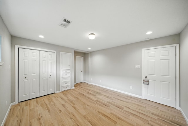 4003 Mischire Dr, Houston, TX 77025 - unfurnished bedroom featuring light wood-style flooring and recessed lighting