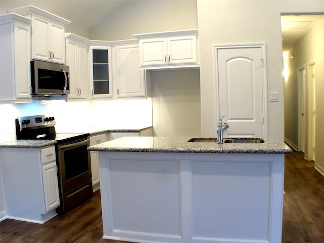 16725 Stonefield, Montgomery, TX 77316 - kitchen with appliances with stainless steel finishes, white cabinets, lofted ceiling, and light stone counters