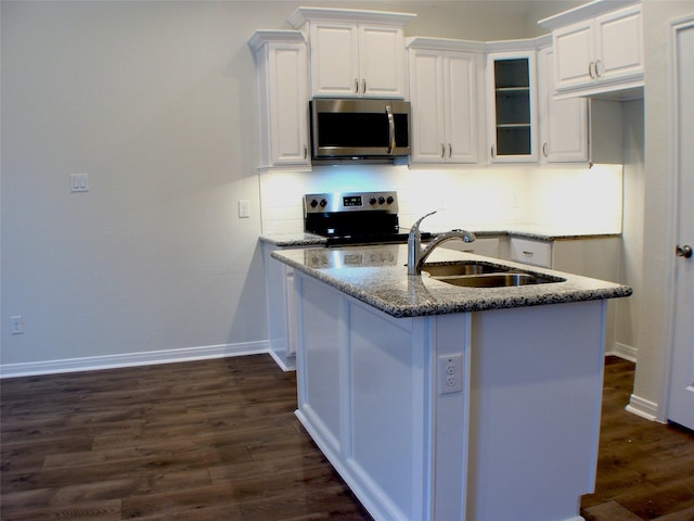 16725 Stonefield, Montgomery, TX 77316 - kitchen with appliances with stainless steel finishes, dark wood-style flooring, stone countertops, and white cabinetry