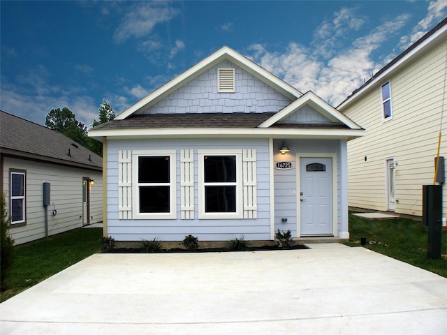 16725 Stonefield, Montgomery, TX 77316 - view of front facade featuring a patio area and a shingled roof