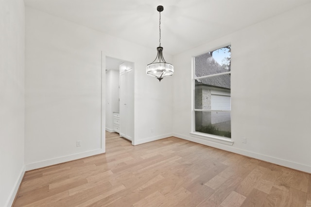 11 Forge Hill Pl, The Woodlands, TX 77381 - empty room with light wood-style flooring and baseboards