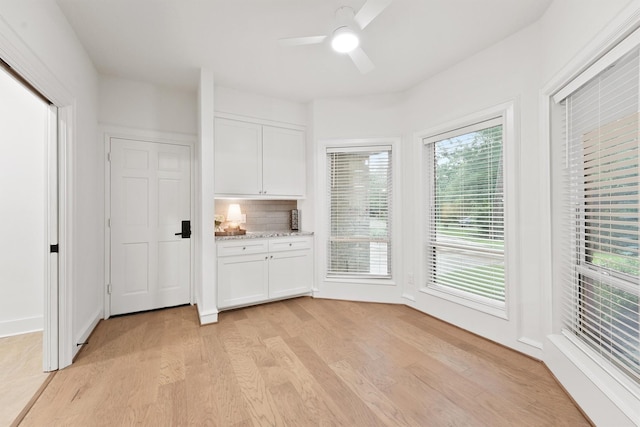 11 Forge Hill Pl, The Woodlands, TX 77381 - unfurnished dining area with light wood finished floors and ceiling fan