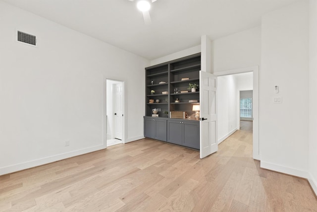 11 Forge Hill Pl, The Woodlands, TX 77381 - unfurnished room with light wood-type flooring and baseboards