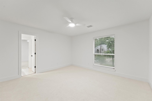 11 Forge Hill Pl, The Woodlands, TX 77381 - spare room with light colored carpet and a ceiling fan