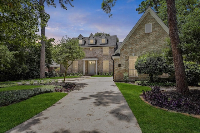 11 Forge Hill Pl, The Woodlands, TX 77381 - french provincial home with brick siding and a front yard