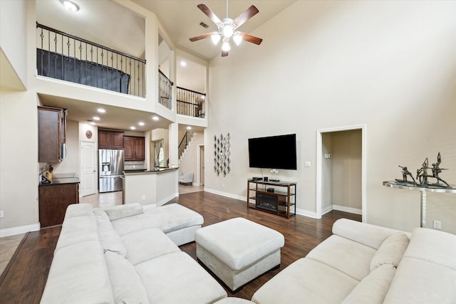28842 Thornbird Ct, Katy, TX 77494 - living area featuring a high ceiling, a ceiling fan, and dark wood finished floors