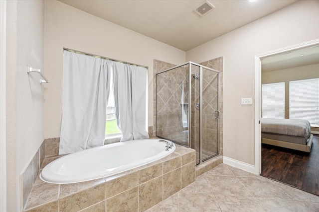 28842 Thornbird Ct, Katy, TX 77494 - ensuite bathroom featuring a garden tub, a shower stall, and tile patterned flooring