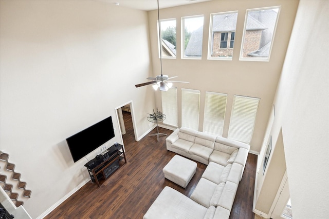 28842 Thornbird Ct, Katy, TX 77494 - living room with wood finished floors, ceiling fan, and a high ceiling