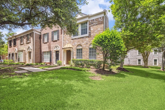 2930 Grants Lake Blvd Unit 2104, Sugar Land, TX 77479 - view of front of house featuring brick siding and a front lawn
