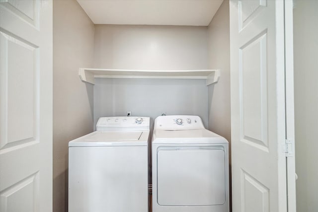 2930 Grants Lake Blvd Unit 2104, Sugar Land, TX 77479 - laundry area with washing machine and clothes dryer
