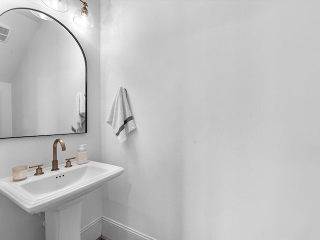 10515 Trinity Springs Dr, Cypress, TX 77433 - bathroom with a sink and baseboards