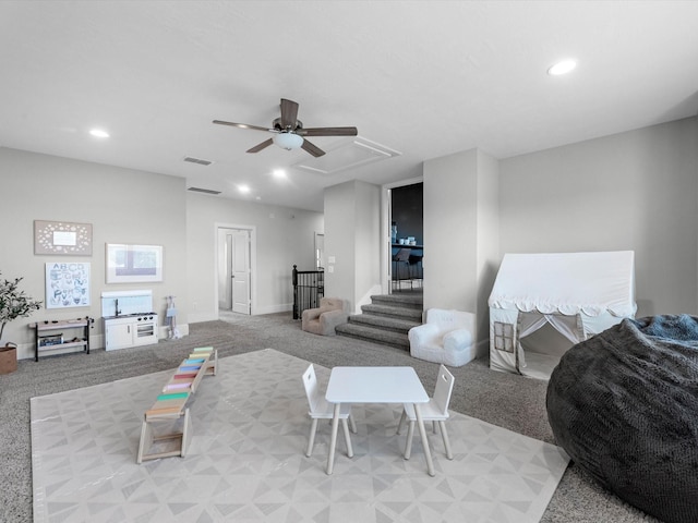 10515 Trinity Springs Dr, Cypress, TX 77433 - carpeted living area featuring attic access, a ceiling fan, and recessed lighting