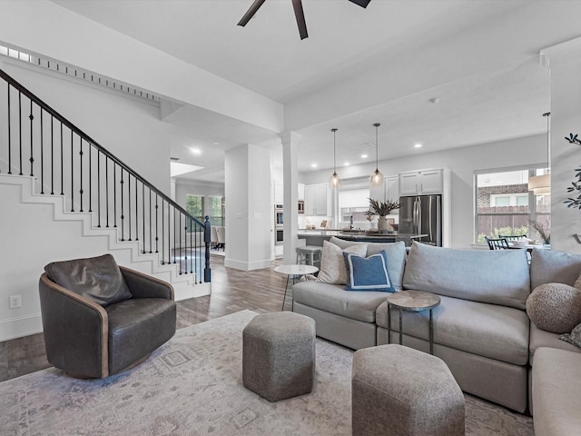 10515 Trinity Springs Dr, Cypress, TX 77433 - living area with wood finished floors, a ceiling fan, plenty of natural light, recessed lighting, and stairway