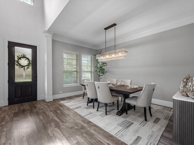 10515 Trinity Springs Dr, Cypress, TX 77433 - dining area featuring healthy amount of natural light, crown molding, and wood finished floors