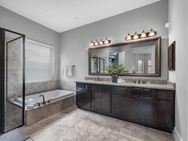 10515 Trinity Springs Dr, Cypress, TX 77433 - bathroom with double vanity, a shower stall, and a bath