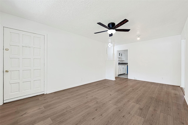 12434 Kathryn St, Houston, TX 77015 - unfurnished living room with a ceiling fan and wood finished floors