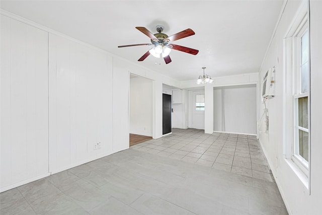 12434 Kathryn St, Houston, TX 77015 - unfurnished room featuring ceiling fan, a chandelier, crown molding, and a decorative wall