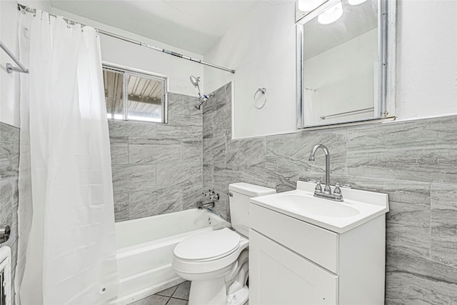 12434 Kathryn St, Houston, TX 77015 - bathroom with tile walls, shower / tub combo, and vanity