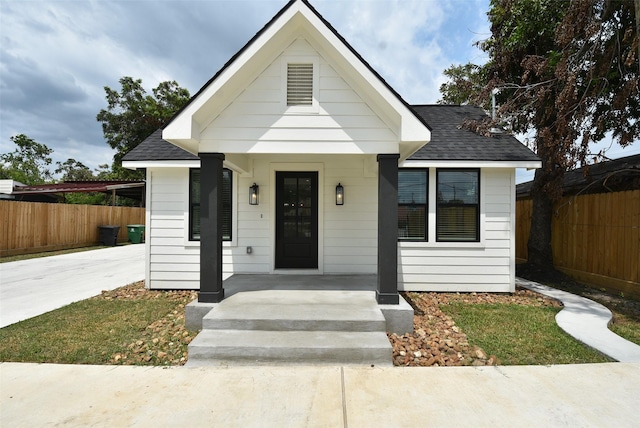 729 Caperton St, Houston, TX 77022 - view of front of property featuring a shingled roof and driveway
