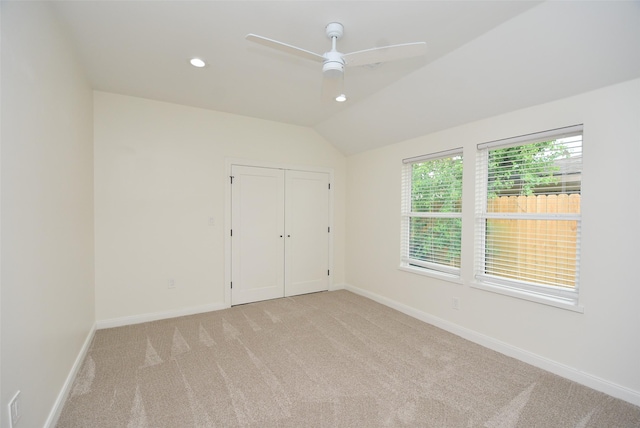 729 Caperton St, Houston, TX 77022 - unfurnished bedroom with light carpet, lofted ceiling, a closet, a ceiling fan, and recessed lighting