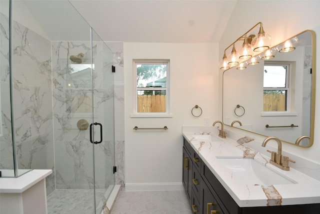 729 Caperton St, Houston, TX 77022 - bathroom with plenty of natural light, double vanity, a marble finish shower, and lofted ceiling