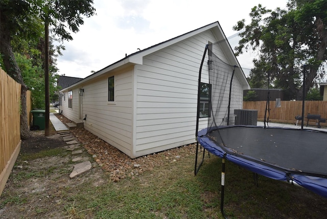 729 Caperton St, Houston, TX 77022 - view of property exterior with a trampoline and a central AC unit