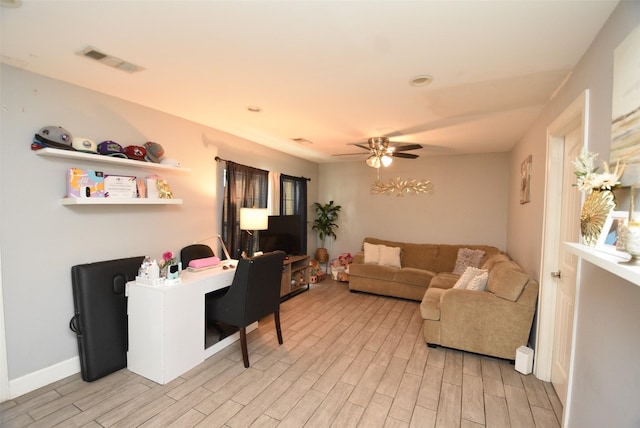 729 Caperton St, Houston, TX 77022 - living room featuring light wood-style flooring and ceiling fan