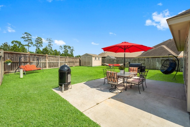 31870 Forest Park Trl, Conroe, TX 77385 - fenced backyard with a storage shed, outdoor dining area, and a patio