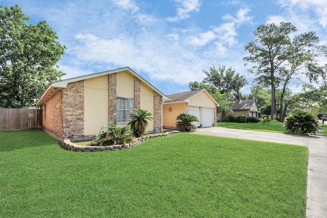 13411 Natasha Ln, Houston, TX 77015 - view of front of home featuring driveway, brick siding, and stucco siding