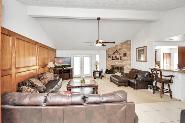 13411 Natasha Ln, Houston, TX 77015 - living room with light carpet, ceiling fan, a fireplace, and light tile patterned flooring