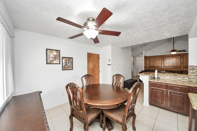 13411 Natasha Ln, Houston, TX 77015 - dining room featuring ceiling fan, a textured ceiling, and light tile patterned floors