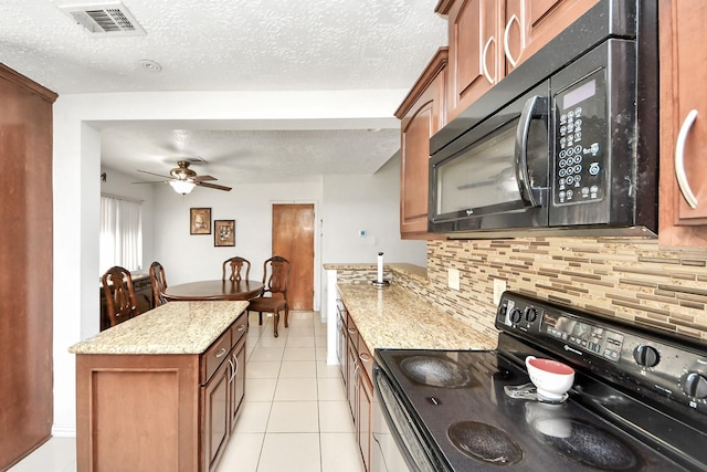 13411 Natasha Ln, Houston, TX 77015 - kitchen featuring black appliances, decorative backsplash, a textured ceiling, ceiling fan, and light stone counters