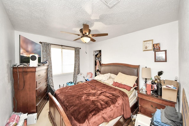 13411 Natasha Ln, Houston, TX 77015 - bedroom with a textured ceiling and ceiling fan