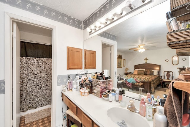 13411 Natasha Ln, Houston, TX 77015 - ensuite bathroom with vanity, a ceiling fan, and curtained shower