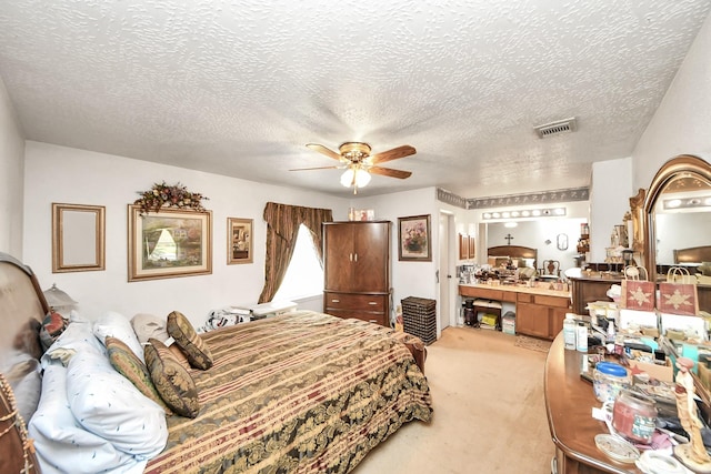13411 Natasha Ln, Houston, TX 77015 - bedroom with light colored carpet, a textured ceiling, and a ceiling fan