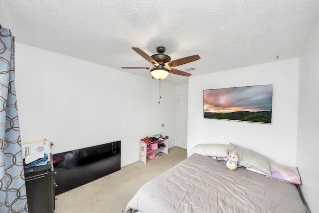13411 Natasha Ln, Houston, TX 77015 - carpeted bedroom featuring a textured ceiling and ceiling fan