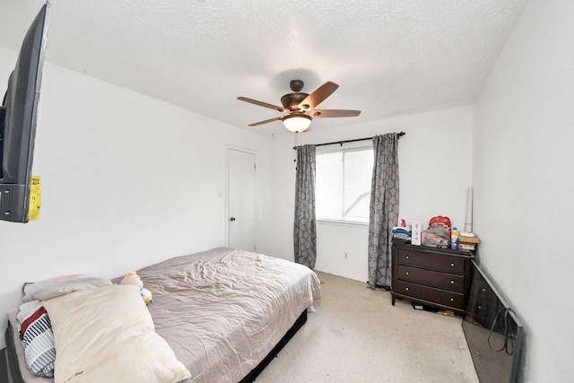 13411 Natasha Ln, Houston, TX 77015 - bedroom featuring carpet, a ceiling fan, and a textured ceiling