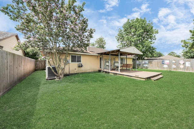13411 Natasha Ln, Houston, TX 77015 - back of property featuring a fenced backyard, a wooden deck, and stucco siding