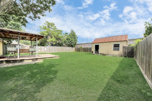 13411 Natasha Ln, Houston, TX 77015 - fenced backyard featuring a deck and an outdoor structure