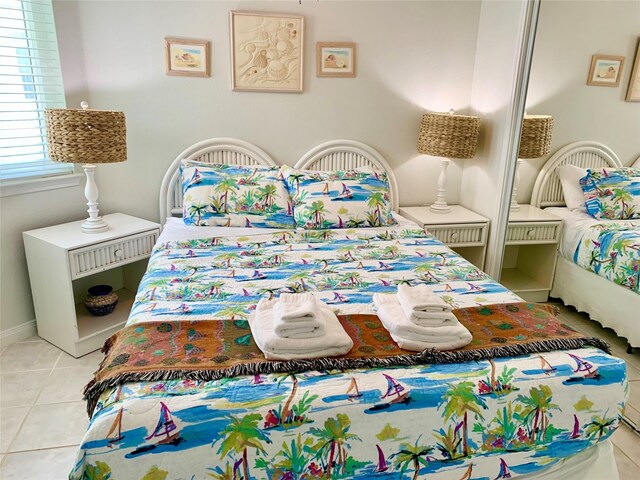 10811 San Luis Pass Rd Unit 1213, Galveston, TX 77554 - tiled bedroom featuring baseboards