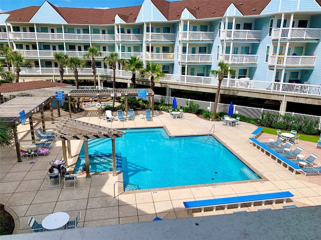 10811 San Luis Pass Rd Unit 1213, Galveston, TX 77554 - community pool featuring a pergola and a patio area
