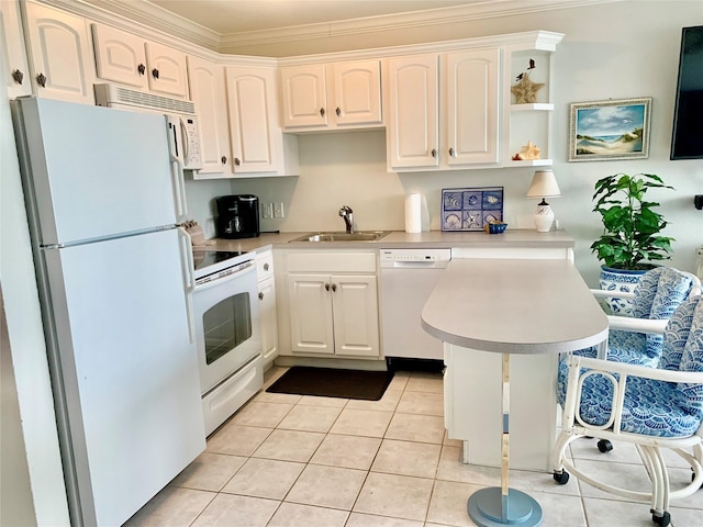 10811 San Luis Pass Rd Unit 1213, Galveston, TX 77554 - kitchen featuring white appliances, light countertops, a peninsula, crown molding, and white cabinets