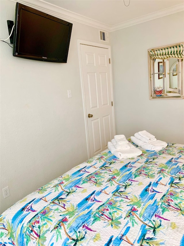 10811 San Luis Pass Rd Unit 1213, Galveston, TX 77554 - bedroom with ornamental molding