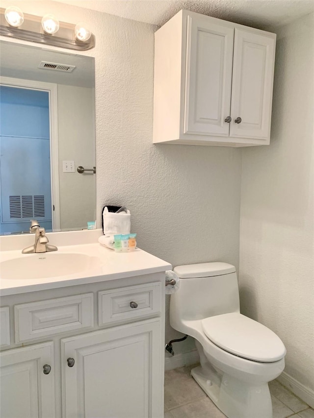10811 San Luis Pass Rd Unit 1213, Galveston, TX 77554 - half bath with tile patterned floors, vanity, and a textured wall