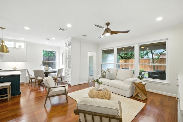 1211 Villmont Ln, Houston, TX 77077 - living room with crown molding, ceiling fan, dark wood-style floors, and recessed lighting