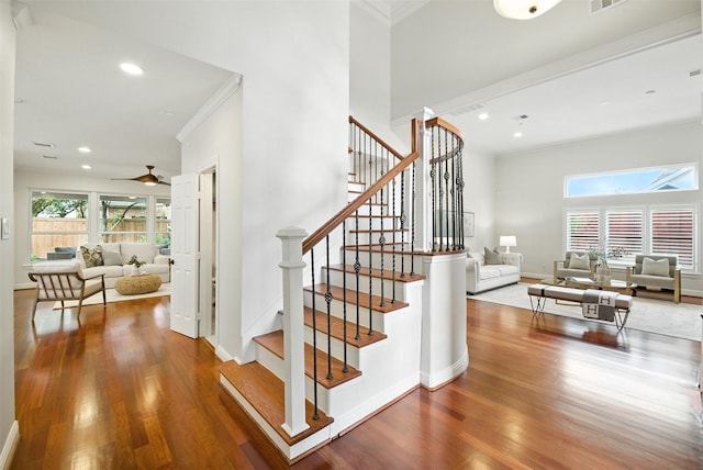 1211 Villmont Ln, Houston, TX 77077 - staircase featuring ornamental molding, wood finished floors, recessed lighting, and a ceiling fan