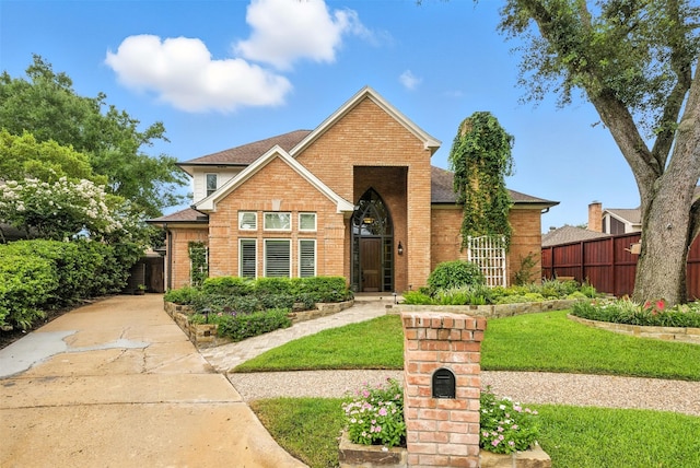 1211 Villmont Ln, Houston, TX 77077 - view of front of house featuring brick siding and roof with shingles