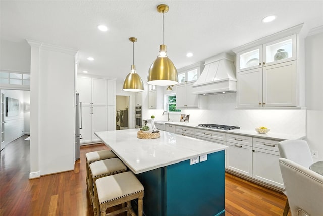 1211 Villmont Ln, Houston, TX 77077 - kitchen featuring premium range hood, white cabinetry, light countertops, recessed lighting, and dark wood-style floors