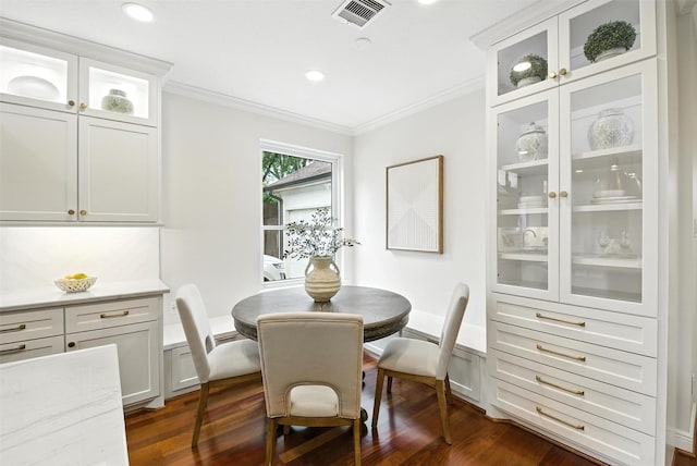 1211 Villmont Ln, Houston, TX 77077 - dining space featuring ornamental molding, dark wood finished floors, and recessed lighting